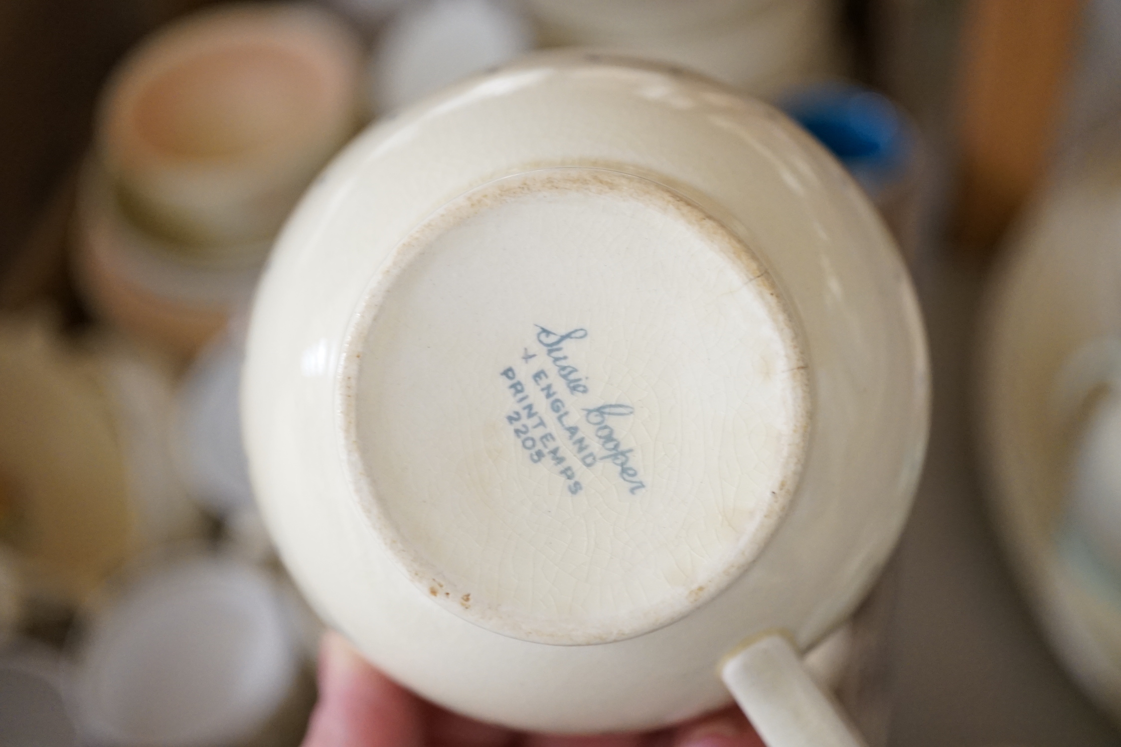 A collection of Susie Cooper ceramics and tablewares including tureens, an oval platter, cups and saucers